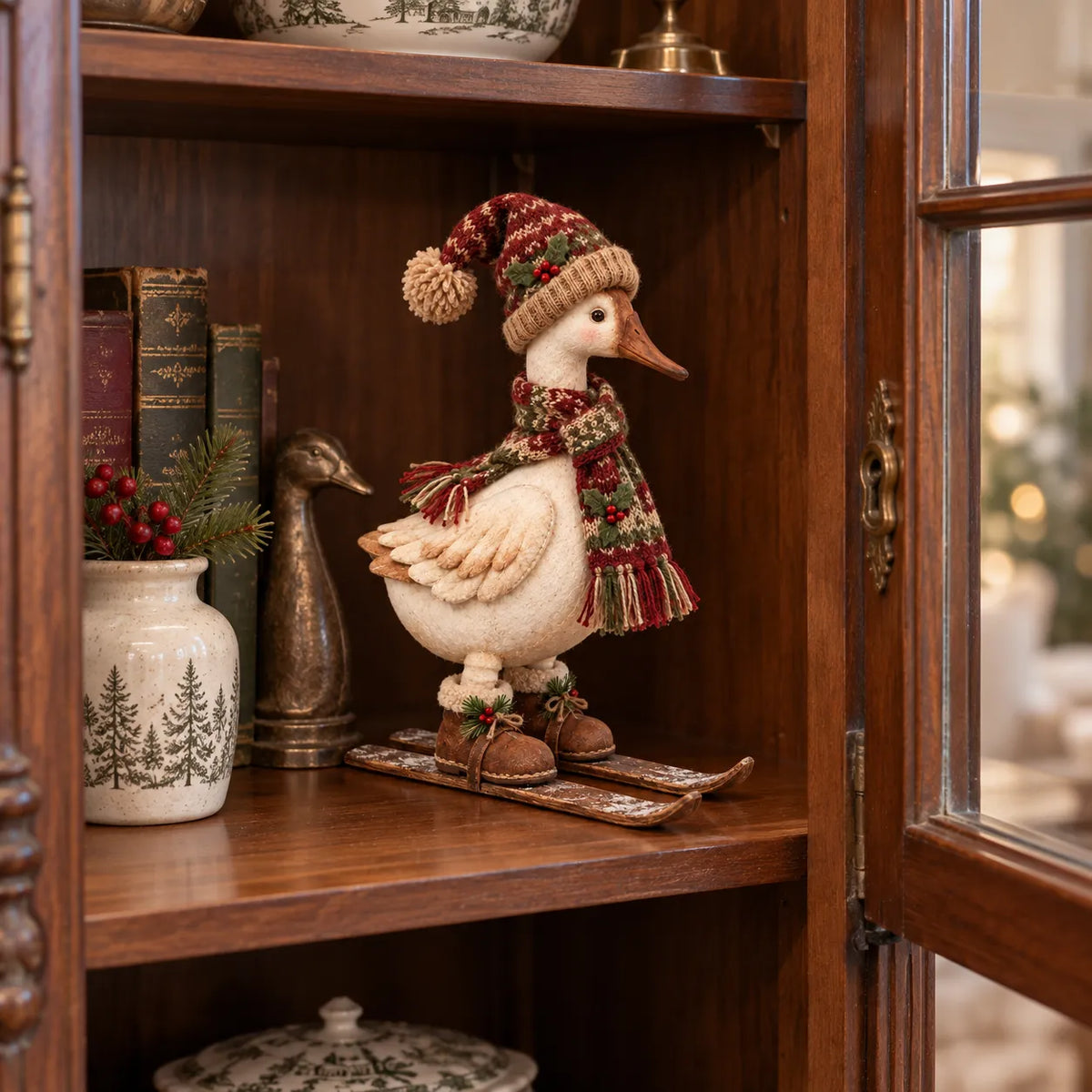 Vintage Christmas Skiing Goose Figurine displayed in wooden cabinet